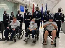 Members of the TSA Midway/O’Hare Honor Guard celebrate the airport’s 100th Honor Flight for senior military veterans. (TSA Midway photo)