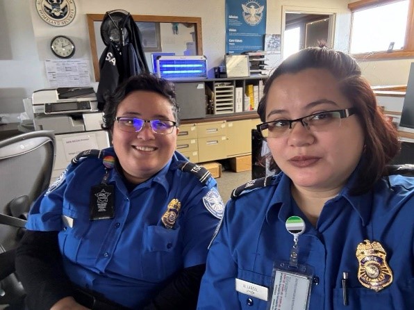 Ciocon and Transportation Security Officer Kawailani Villareal working while sporting their Pride pins. (Photo courtesy of Jessica Ciocon)