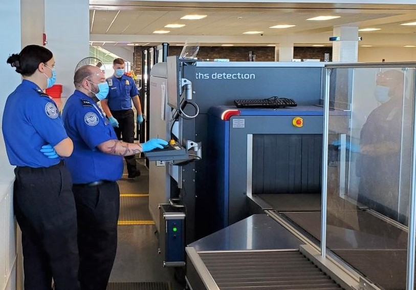 TSA officers work at the security checkpoint at Syracuse Hancock International Airport. (TSA photo)