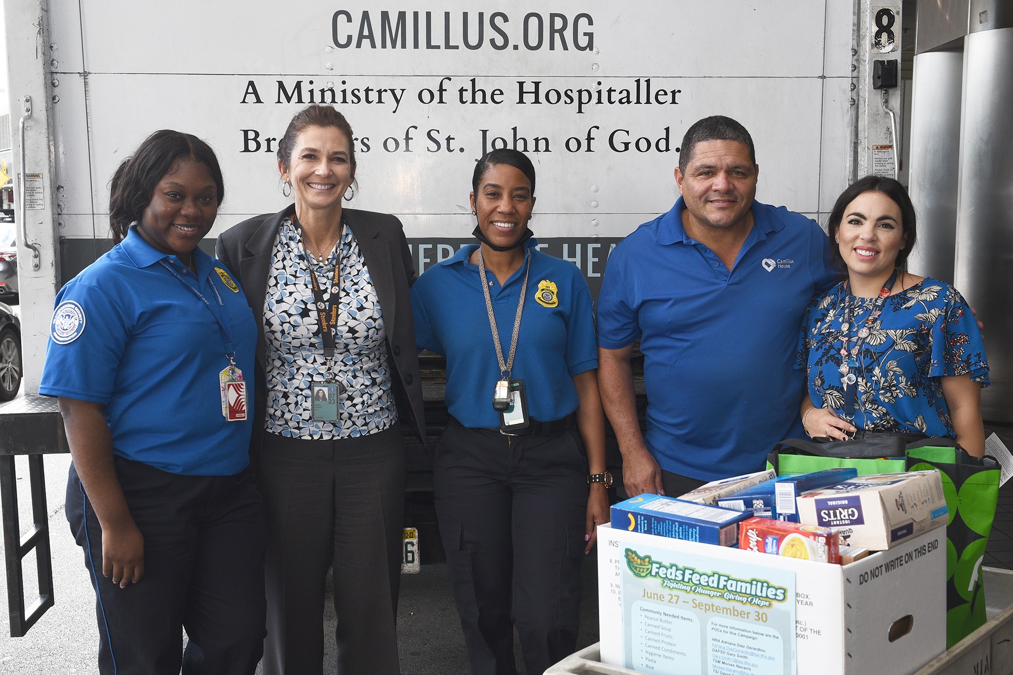 Jenel Chang and her former MIA colleagues during a Feds Feed Families campaign. (Photo courtesy of Jenel Chang)