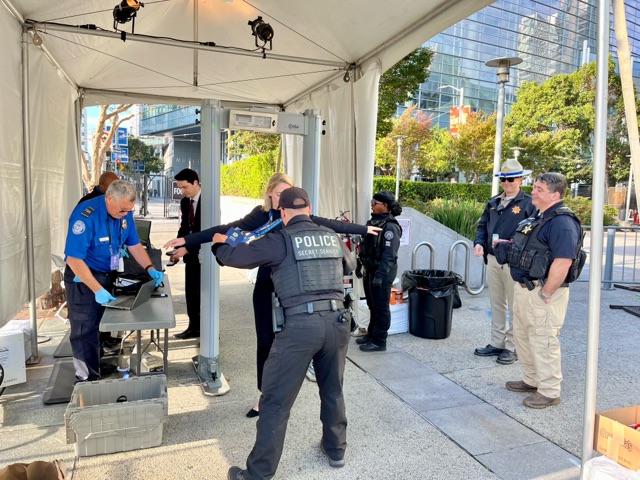 NDF TSO George Hunsinger and a USSS Officer inspect and screen all persons and property entering through one of many security checkpoints at the APEC venue. (Photo courtesy of Albert Stallcup)