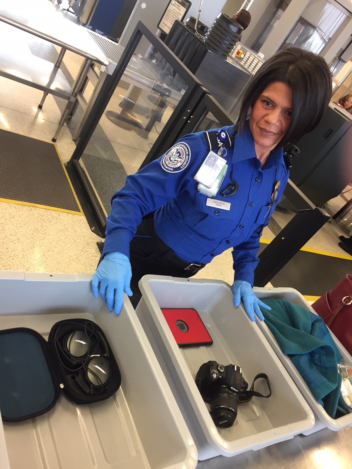 TSA officers at Norfolk International Airport are advising passengers to remove personal electronics that are larger than a cell phone from their carry-on bags and place them in bins at the checkpoint as an enhancement of security. (TSA photo)