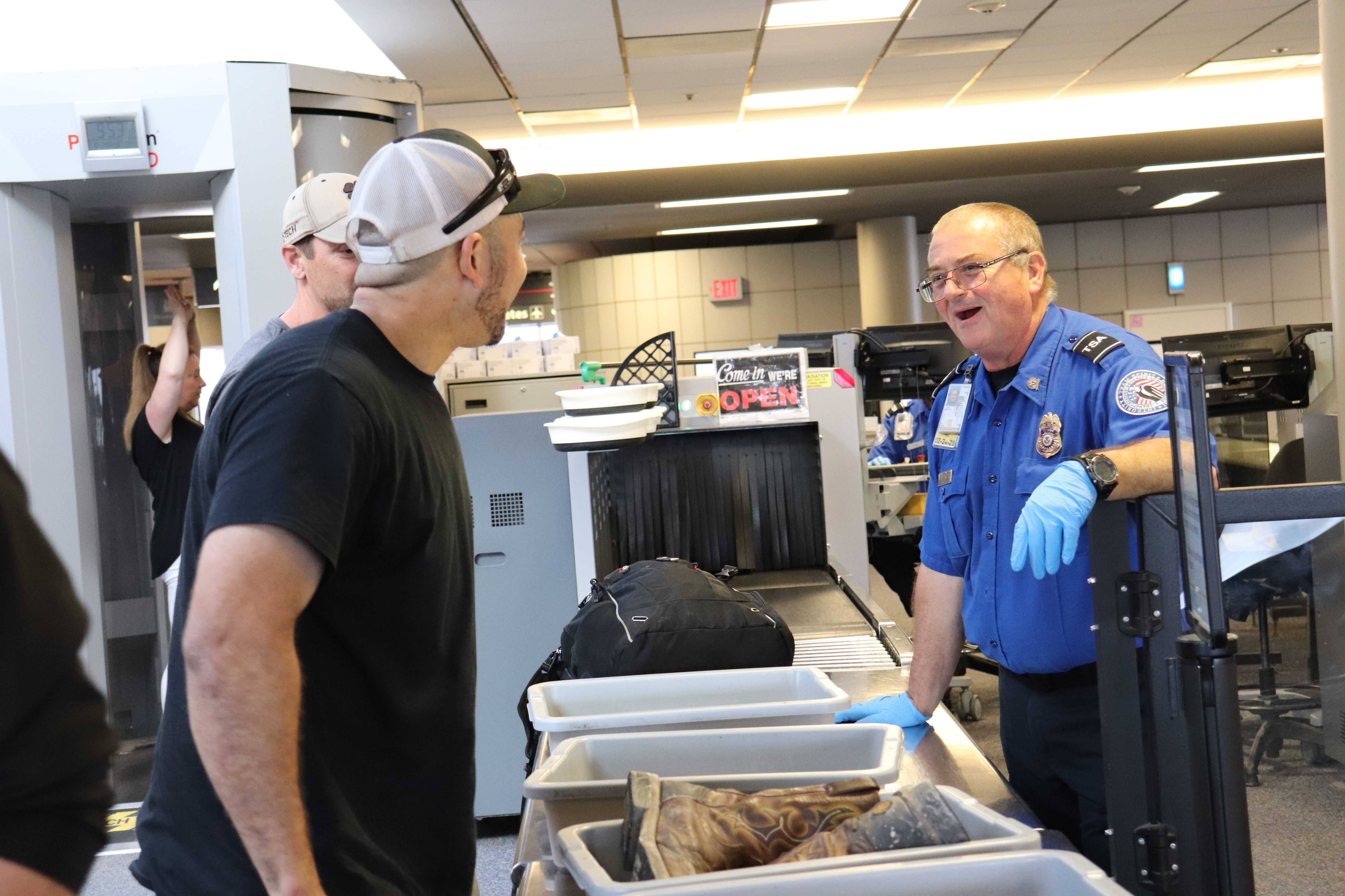 TSA officers offer helpful guidance to passengers at security checkpoints. (TSA photo)