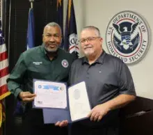 Louisiana Federal Security Director Arden Hudson presents Program Specialist Michael Billings with a 20-year certificate.  (Photo courtesy of Michael Billings)