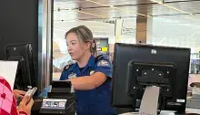 Newark Liberty International Airport TSA Officer Emma Denby concentrates as she checks IDs at the travel document checker position. (Photo by Almetra Strand)