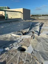 SRQ's membrane roof peeled away under Milton's relentless winds. (SRQ photo)