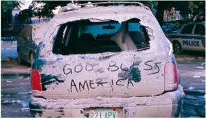 FAMS Special Agent in Charge Eric Sarandrea wrote “God Bless America” on this car near Ground Zero the day after the 9/11 attacks. (Eric Sarandrea photo)