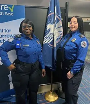 TSA Officers Sherelly Johnson, Carole McGonigle (LGA photo)