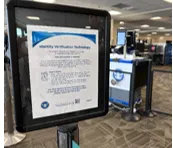 Signage in the security checkpoint describes the facial matching, identity verification process to travelers.
