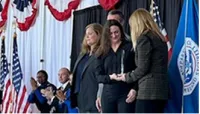 Spokane Field Intelligence Officer Amanda Houck receives award from Department Homeland Security Senior Official Performing the Duties of the Deputy Secretary Kristie Canegallo. (TSA Staff photo)