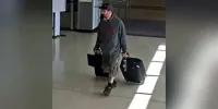 Lehigh Valley International Airport CCTV screenshot released by the FBI of Marc Muffley rolling two bags. (NPR screenshot)