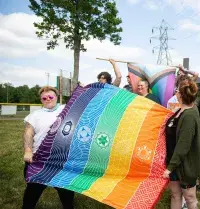 From left, Kris M. and friends form a human wall in front of protesters during the 2023 Essex Pride Festival. (Photo courtesy of Kris M.)