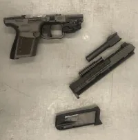 This disassembled firearm was detected in a traveler’s duffle bag by TSA officers at Newark Liberty International Airport on Oct. 16, 2024. The parts were concealed in a boot and in a LEGO box. (TSA photo)