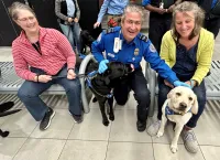 The TSA officers enjoyed the experience of screening the guide dogs in training. (TSA photo)