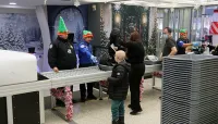 TSA officers screen special guests for the Fantasy Flight at IAD. (Stan Pardos) 