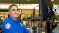 Working X-ray, TSA Officer Lito Marrero caught two weapons in one shift. (Pete Aiuto photo)