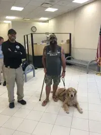 From left, RSW Canine Supervisor Wyatt Rhoden, USAF Veteran Dave and Golden PAWS service dog Freedom. (Photo courtesy of Golden PAWS) 