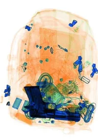 TSA X-ray image of a firearm in a backpack. (TSA photo)