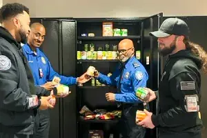 Baltimore/Washington International Thurgood Marshall Airport Supervisory TSA Officer Gregory Gee (2nd from right) gives his time and donations to the BWI employee food bank. (Photo by Albert Guerrero)