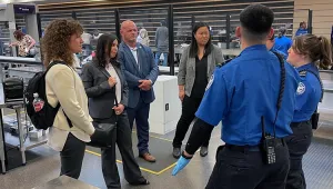 TSA Officers Taite Saldana and Grace Kerner discuss checkpoint operations with Security Operations Executive Assistant Administrator (AA) Melanie Harvey, Operations Management AA Rana Khan, Federal Security Director Anthony Metcalf and Acting Chief of Staff Myung Kim. (Sam Fuller photo)
