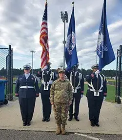 LGA TSA Color Guard with Army Sgt. Jennifer Torres who sang the National Anthem. 
