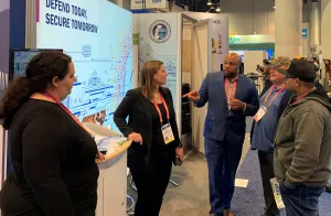 Innovation Task Force Program Manager Louis Fletcher works TSA’s booth at the 2023 Consumer Electronics Show. From left, contractor Catherine Conti and Program Manager Lucy Rimensnyder. (Photo courtesy of Louis Fletcher)