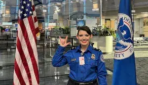 HSV TSA Officer Kayla Lowery-Busick signs “I love you.” (Photo by Autumn Lovill)