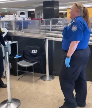 Seattle-Tacoma International Airport Supervisory TSA Officer Teri Shoemaker in action at a SEA checkpoint. (Photo courtesy of TSA SEA)