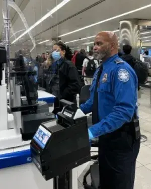 Supervisory Officer Gregory Gee at the Travel Document Checker. (Photo by Albert Guerrero)