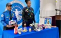 TSA officers at BWI Airport discuss which items can go in a carry-on bag and which should go into a checked bag. (TSA photo)